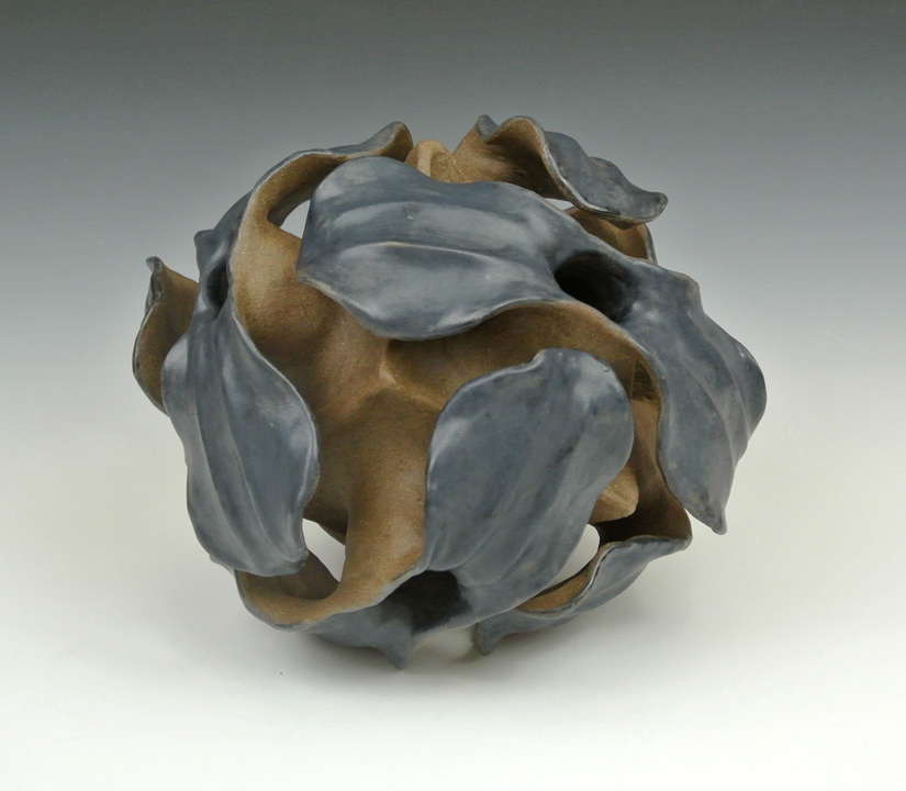 Ceramic sculpture of a biological polyhedral form.