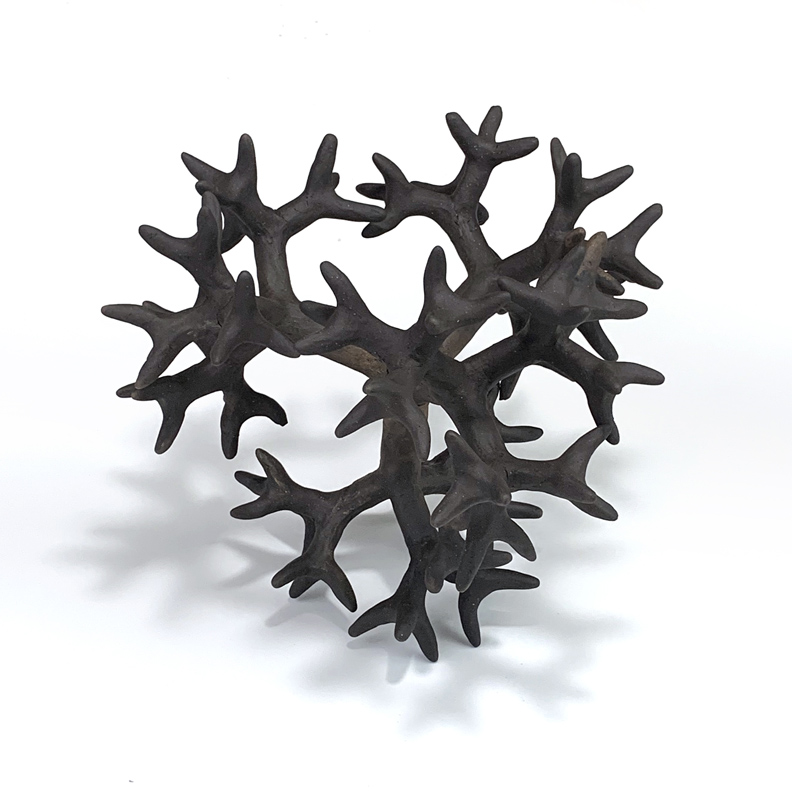 Ceramic sculpture of an branching form based on hyperbolic geometry.