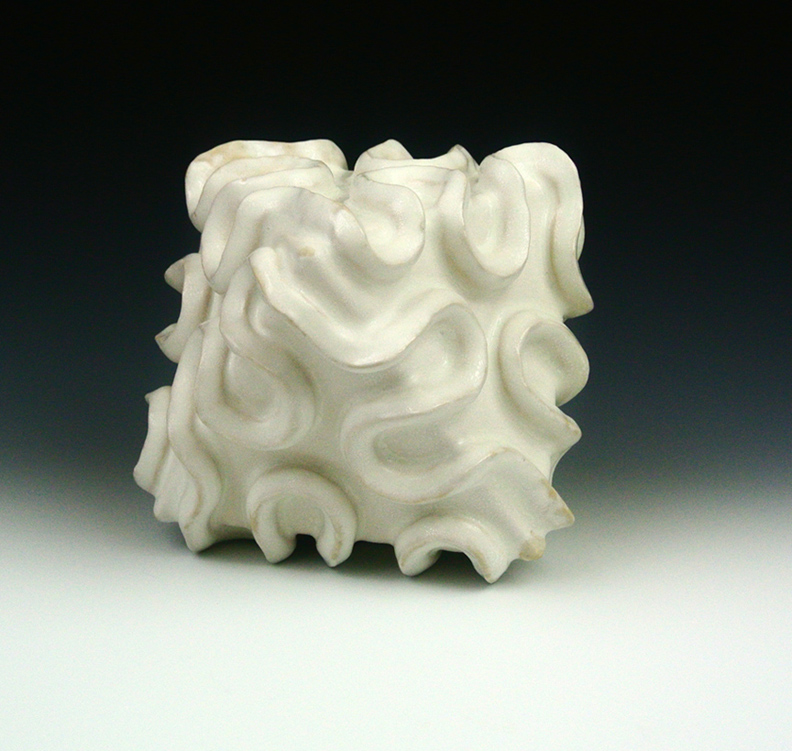 Ceramic sculpture of an organic octahedral form.