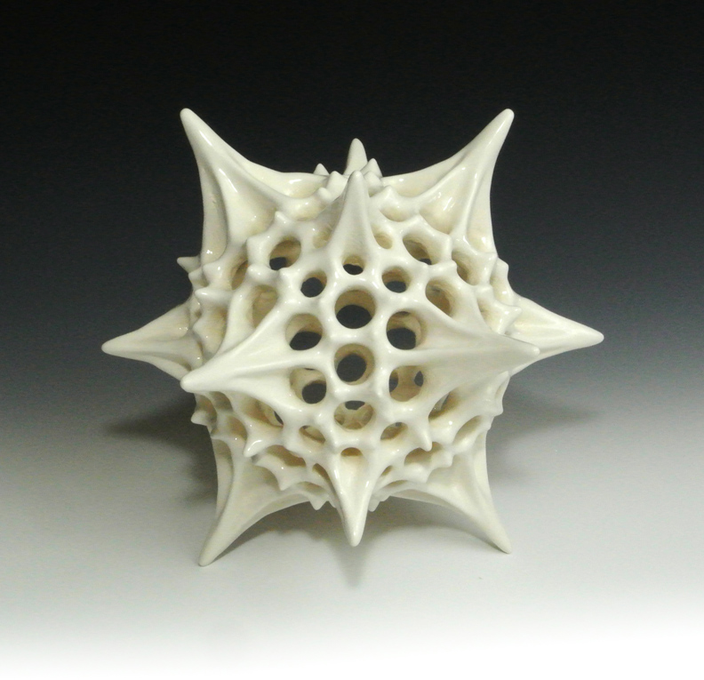 Ceramic sculpture of a biological polyhedral form, first view.