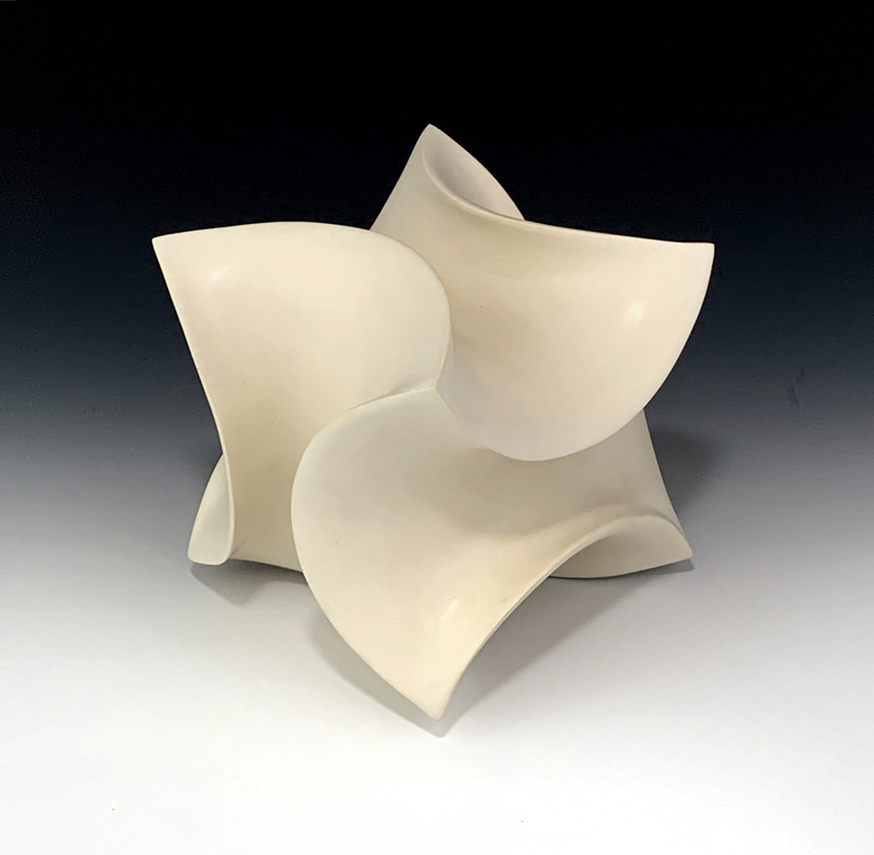 Ceramic sculpture of a distorted cube form.