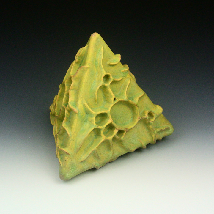 Ceramic sculpture of an organic polyhedral form.