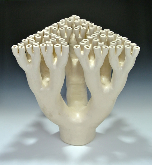 Organic-looking ceramic sculpture based on a fractal tree Sierpinski triangle first view.
