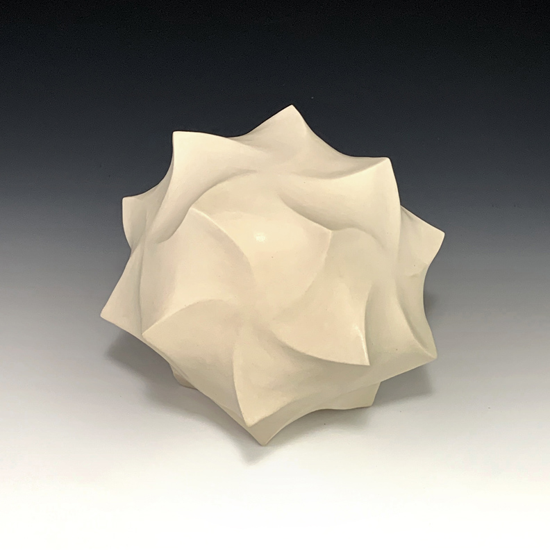 Ceramic sculpture of a distorted dodecahedron.